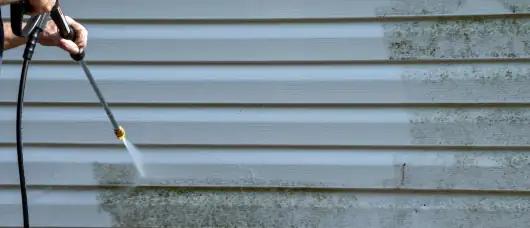 Power washing a building
